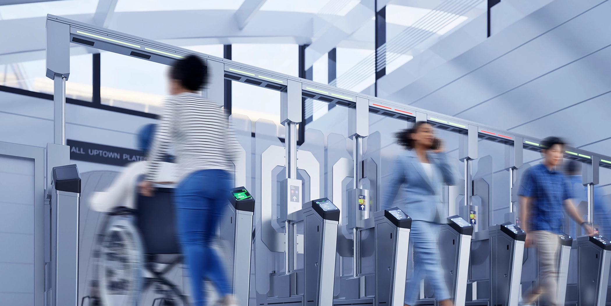 People walking through Cubics FEnX Fare Gate, with one individual using a wheelchair for accessibility