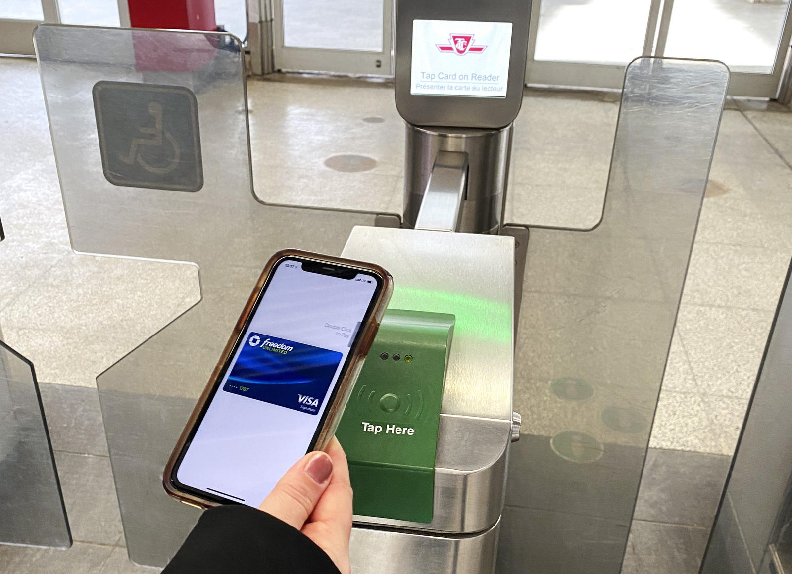 Mobile Phone tap on gate validator visa