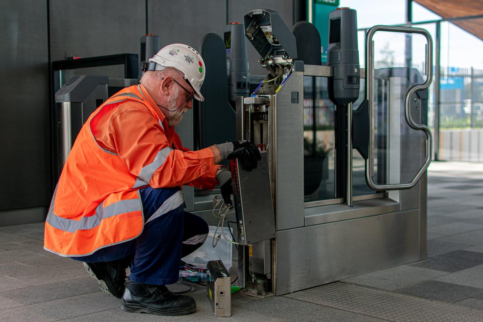 Cubic employee servicing fare gate 