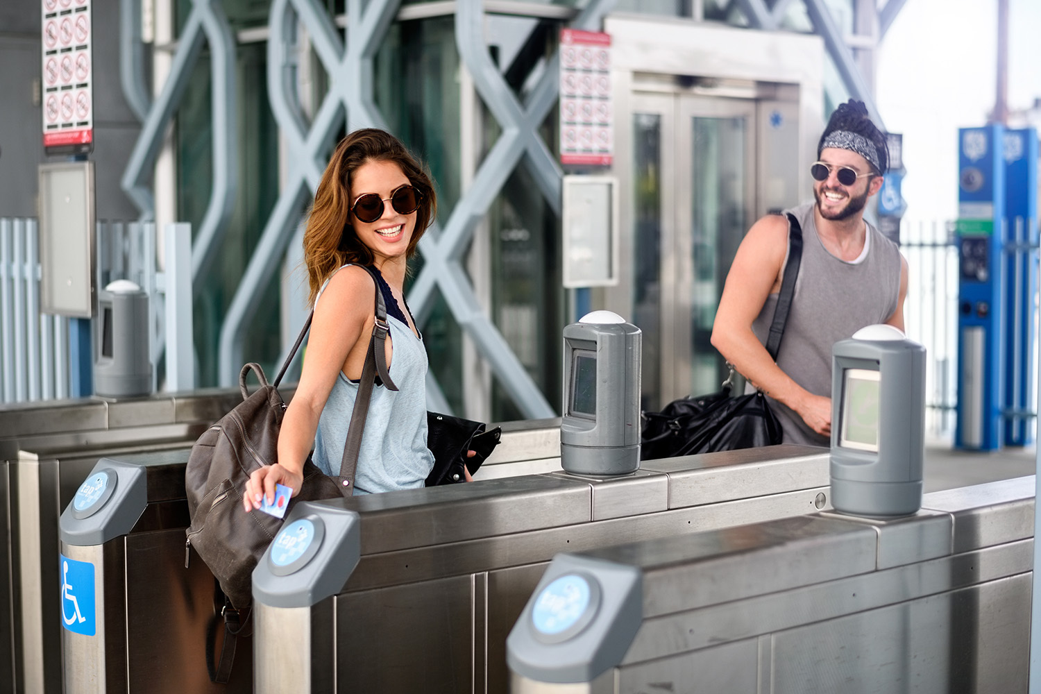 Women tapping transit card on fare gate